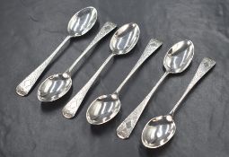 A cased set of six Edwardian silver teaspoons, having decorative engraving to the handles and