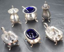 An assortment of six 20th century silver salts, mustards and pepperettes, all having Chippendale