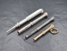 A 9ct gold propelling pencil, having a blood stone end, along with three silver plated and white