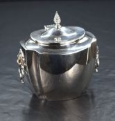 A late Victorian Scottish silver sucrier, of fluted oval form, having a spiral finial with