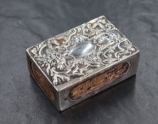 A Victorian silver match box holder, having embossed scroll work and depictions of the Green Man,