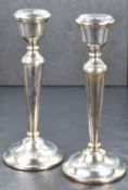 A pair of Elizabeth II candlesticks, of traditional form having moulded sconces, knopped stems on