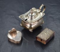 An Edwardian silver match box cover, having embossed scroll work and vacant central cartouches,