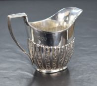 A Victorian silver cream jug, of traditional form having a generous spout opposed by an angular