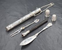 An Edwardian silver bodkin case, of long cylindrical form having planished decoration, marks for