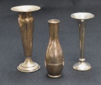An Elizabeth II silver vase, of narrow bulbous form with line engraving to the body on a circular