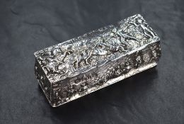 A Victorian silver trinket box, having embossed decoration depicting a hunting scene to the lid with