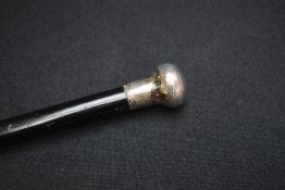 A George V silver mounted malacca walking cane, the dark wood cane with rounded silver mounted