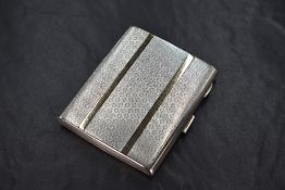 A George V silver cigarette case of hinged rectangular form, having engine turned decoration with