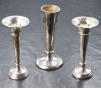 Three George V silver vases, all of fluted form with two having flared rims and step moulded