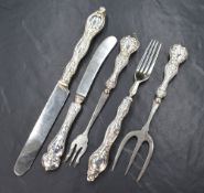 A pair of Victorian silver knife and fork sets, having embossed floral scroll decoration to the