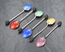 A set of six George V enamelled silver coffee bean spoons, of traditional form each having a