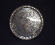 A large and impressive Victorian silver salver, of circular form having a bead thread rim with