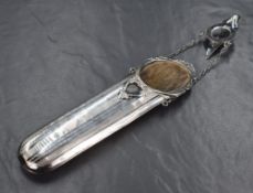 An early George V silver mounted spectacles case, of traditional form having scroll and shell work