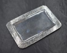 A continental 900. grade white metal visiting card tray, the shallow tray having a decorative