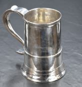 A George III silver tankard, of traditional form having moulding to the body and S shaped handle, on