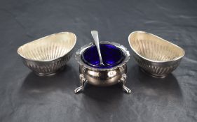 A pair of Edwardian silver salts, of oval form having half fluted bodies, marks for Birmingham 1904,