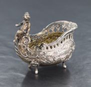 A 800. grade white metal salt, of oval form in a carriage motif with pierced sides and embossed