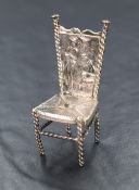 A Victorian 930. grade white metal puppenhaus high back chair, having barley twist legs with a