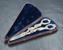 A pair of William IV silver grape scissors, having handles depicting grape vines, marks for London