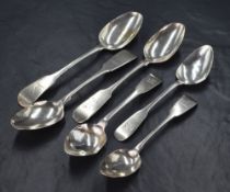 Six George III Irish silver fiddle pattern spoons, all with heraldic crests to the terminals, two