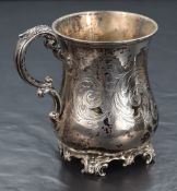 A Victorian silver cup, of bulbous form having decorative scroll engraving to the body and a central