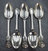 A set of five Victorian silver fiddle pattern serving spoons, having thread and shell decoration