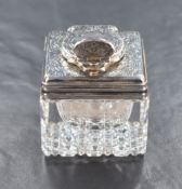 A Victorian silver mounted cut glass inkwell, of square form having decoratively cut base with