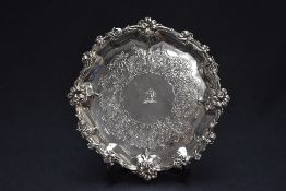 A fine Victorian silver salver, having an embossed floral scroll rim with shell, scroll and floral