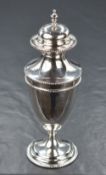 Am Edwardian silver sugar caster, of fluted form having minimal finial with bead thread to rim, with