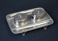 A Victorian silver inkwell stand, of rectangular form having gadrooned rim and decoration, with