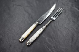 An early 20th century cased set of white metal and mother-of-pearl dessert knives and forks, the