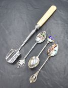An early George V stilton scoop, of traditional form having a white metal scoop and silver ferrule