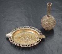 A 900. grade white metal ashtray, of oval form having a decorative pierced scroll rim, with embossed