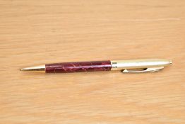 A Conway Stewart Conway 90 ballpoint pen in red cracked ice with gilt cap