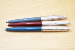 Three Parker 51 ballpoint pens in teal, grey and burgundy all with rolled silver caps with gold
