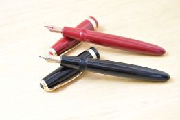Two Parker Duofold Demi aerometric fill fountain pens one Burgundy one black both with Duofold broad