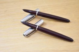 Two Parker 51 aerometric fountain pens in burgundy with lustraloy caps