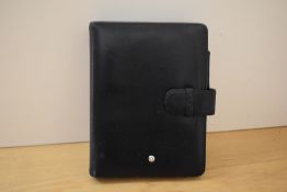 A Montblanc A6 organiser in black leather. Some wear. 15x19.5cm