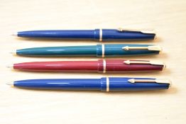 Four Parker 17 Jotter ballpoint pens in black, red, green and blue. One with chalk mark