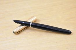 A Parker 51 aerometric fill fountain pen in black with rolled gold cap. Dents to cap