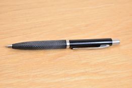 A Parker Reflex ballpoint pen in black with chrome trim