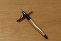 A Parker 45 Insignia CT rollerball pen in gold fill with black tassie