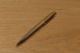 A Parker 45 ballpoint pen in gold reeded design