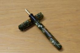 A Wahl (Eversharp) Oxford lever fill fountain pen in green marble with two narrow cap bands having