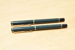 A Parker 88 Rialto cartridge fill fountain pen and roller ball pen set in laque dark green having