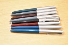 Eight Parker 51 ballpoint pens in black, two teal, grey, navy grey,green, brown and burgundy all