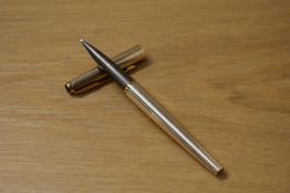 A Parker 50 Signet converer fill fountain pen gold plated fluted design having medium nib