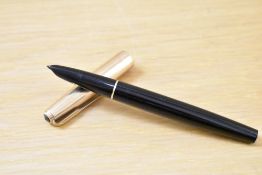 A Parker 51 aerometric fill fountain pen in black with a rolled gold cap