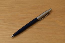 A Parker Jotter ballpoint pen in dark blue with metric converter